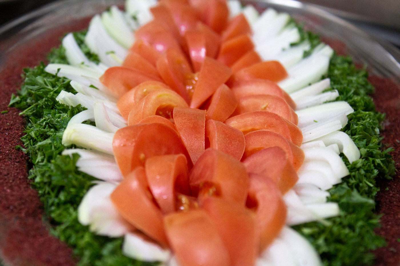 tomatoes, onions, and cilantro on a plate