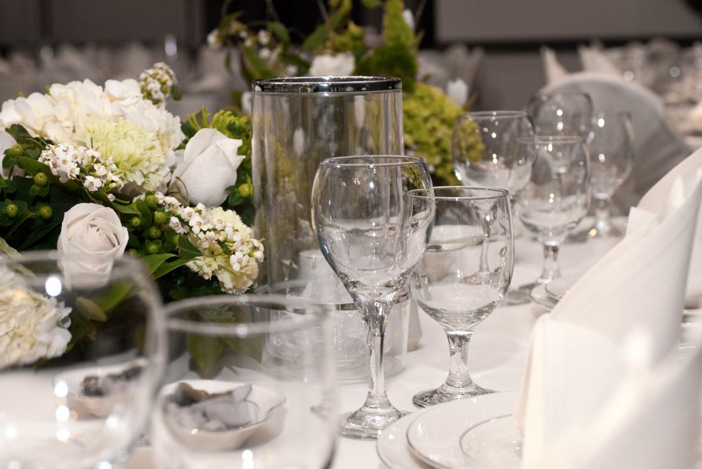 wedding table decorated with glasses and flowers